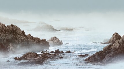 Serene Coastal Landscape with Rocky Shoreline and Misty Ocean Views