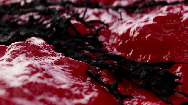 3d animation depicts the growth of malignant cancer cells aggressively spreading across tissue. The black structures represent metastases infiltrating the inflamed, bright red surface of the organ.