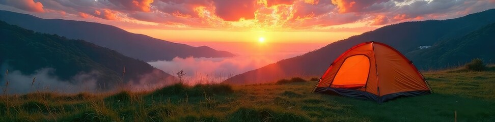 Fototapeta premium A vibrant sunrise paints the sky over a tent pitched in a lush, green meadow, mist clinging to the hills in the background The perfect weather camping scene , wild, serene, hills