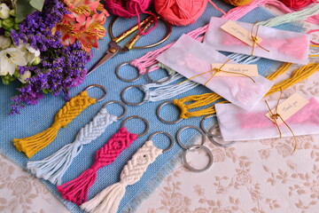 Fototapeta premium Wedding favors gift macrame key chain making cotton rope scissors flowers thank you lable tag handmade souvenirs crafting for spring summer party guests, holidays hobby 
