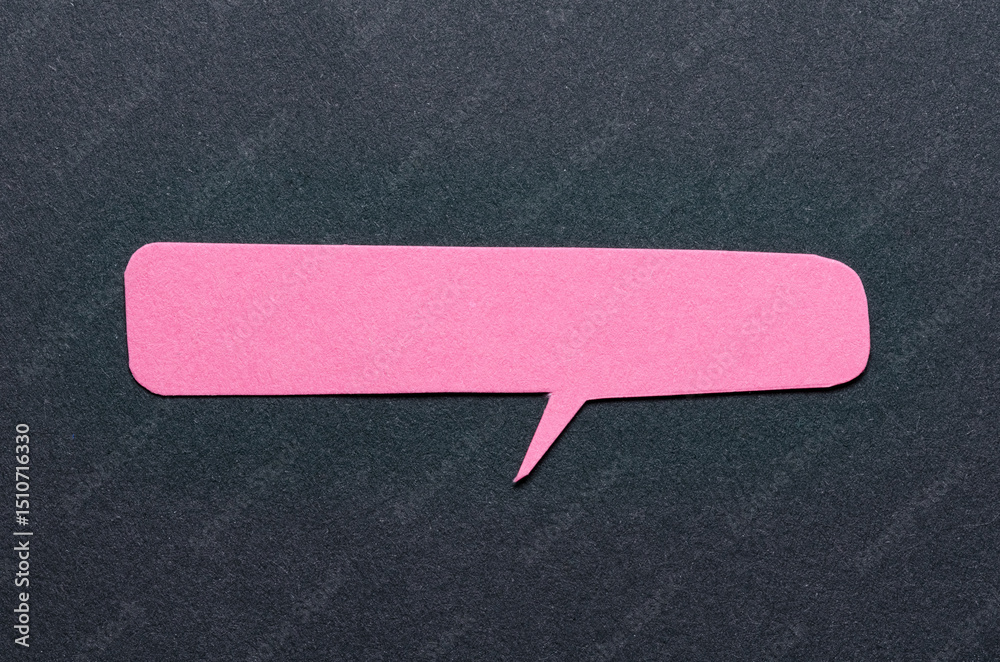 Poster Pink cut out blank paper speech bubble of rectangular shape and rounded corners with copy space for text on dark background, flat lay top view conceptual backdrop