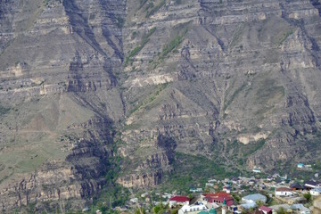 The village is located against the backdrop of a majestic mountain. Dagestan.