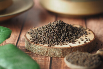 natural tea leaf on wooden table 