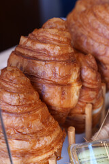 Croissants arranged on a display in a bakery