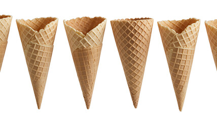 Delicious crispy waffle ice cream cones arranged in a row against a black background perfect for summer dessert menus or food blogs