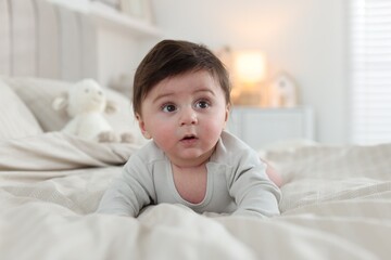 Bedtime. Cute little baby on bed at home