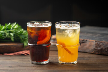 Side view on two glasses of fresh lemonades with ice