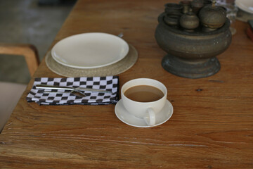 Elegant Coffee Break Setting with Cappuccino and Empty Plate