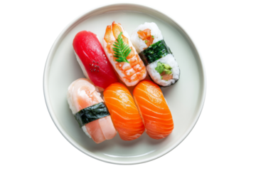 Assorted nigiri and sushi rolls served on round white plate from top view isolated on transparent background