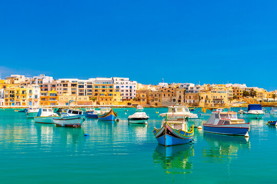 A view of numerous fishing boats in St George's Bay in Birzebbuga, a small coastal town in Malta