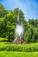 Water fountain in a park in springtime