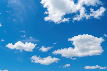 Naklejka premium 青空に浮かぶ白い雲の背景素材
