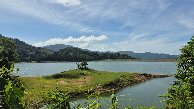 lake and mountains with the clouds in the sky