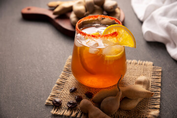 Tamarind drink. Agua de Tamarindo, is one of the traditional "Aguas Frescas" in Mexico. Infused drink made with tamarind to which beneficial health properties are attributed.
