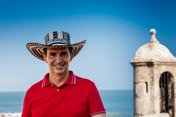 Male tourist wearing a sombrero vueltiao in Cartagena. Colombian people. Travel concept.
