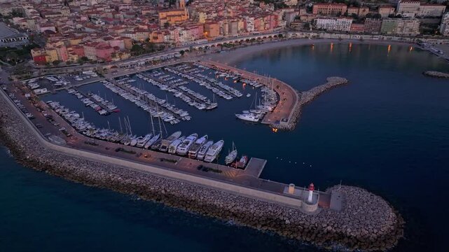 French Riviera Menton shines in early dawn light, France. Aerial drone video