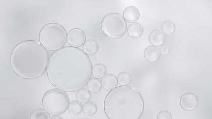 Transparent skincare serum texture with air bubbles on light background
