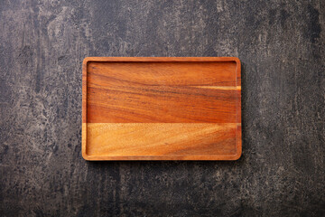 Wooden cutting board. Dark background. Copy space. Top view.