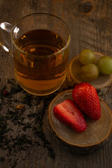a glass of green tea, fresh strawberries, and juicy grapes, evoking a feeling of healthy indulgence and pure wellness. Ideal for clean eating, healthy recipes, or mindful lifestyle content