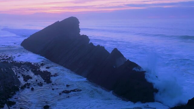 Aerial view of the sunset lights on the cliffs of Madero Beach in the Dunes of Liencres Natural Park. Pi&eacute;lagos Municipality, Costa Quebrada Geopark, Cantabrian Sea, Cantabria, Spain, Europe
