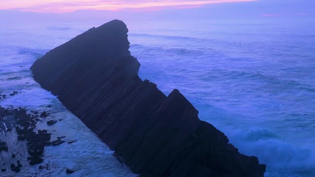 Aerial view of the sunset lights on the cliffs of Madero Beach in the Dunes of Liencres Natural Park. Pi&eacute;lagos Municipality, Costa Quebrada Geopark, Cantabrian Sea, Cantabria, Spain, Europe