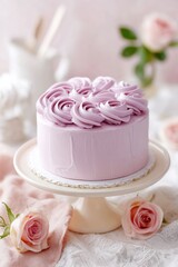 Beautiful pink frosted cake decorated with rose-shaped icing sits elegantly on a white cake stand, surrounded by soft pastel flowers and delicate fabric, creating a charming dessert display