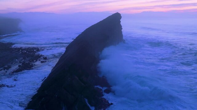 Aerial view of the sunset lights on the cliffs of Madero Beach in the Dunes of Liencres Natural Park. Pi&eacute;lagos Municipality, Costa Quebrada Geopark, Cantabrian Sea, Cantabria, Spain, Europe