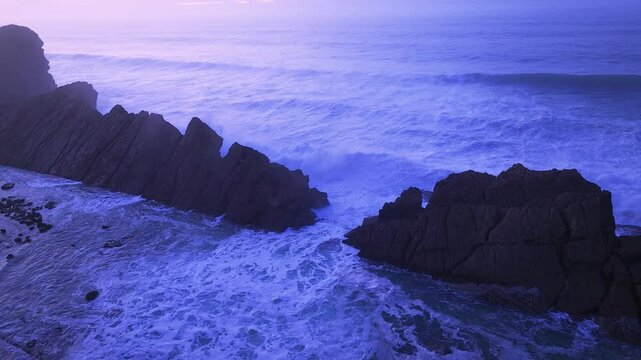 Aerial view of the sunset lights on the cliffs of Madero Beach in the Dunes of Liencres Natural Park. Pi&eacute;lagos Municipality, Costa Quebrada Geopark, Cantabrian Sea, Cantabria, Spain, Europe