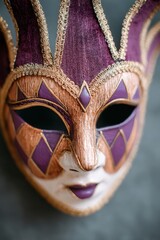 Ornate masquerade mask featuring intricate purple and gold designs, showcasing craftsmanship and artistry, perfect for festive occasions and theatrical performances