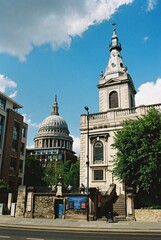 St Nicholas Cole Abbey, City of London, with St Paul's Cathedral in the background.
