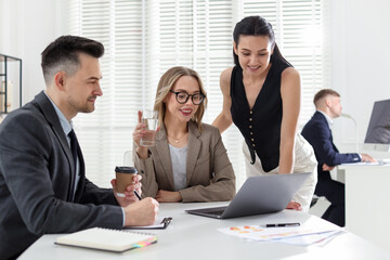 Marketing. Team of businesspeople working together at desk in office