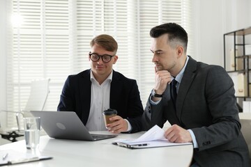 Marketing. Two colleagues working together in office
