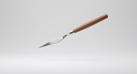 Studio Shot of a Professional Painting Palette Knife with Wooden Handle Against a Clean White Background