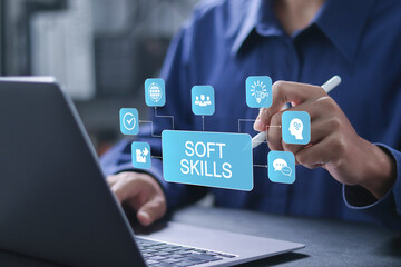 Soft skills concept. work performance is influenced by skills, abilities, and competence. Businessman using laptop with soft skills icons on virtual screen.