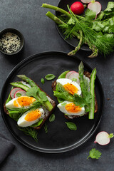 sandwich with dark rye bread asparagus and soft boiled egg