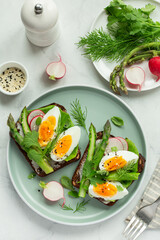 sandwich with dark rye bread, asparagus and soft boiled egg