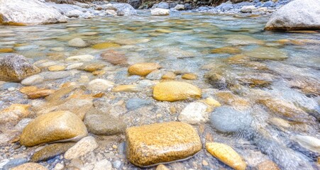 Calm river flowing over colorful stones nature scene close view