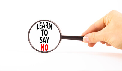 Learn to say no symbol. Concept words phrase Learn to say no in beautiful magnifying glass....