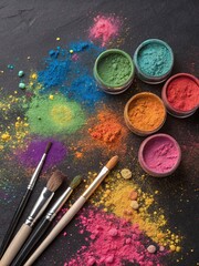 Fototapeta premium Vibrant Powdered Pigments with Brushes on Dark Surface