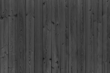 Fence of wooden black boards. Wooden vintage boards.