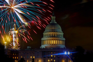 Fireworks burst above Capitol dome building during Fourth of July nighttime celebration in Washington D.C.