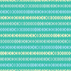 Hand drawn diamonds pattern background tile. Doodle argyle design vector seamless in yellow, blue and green.