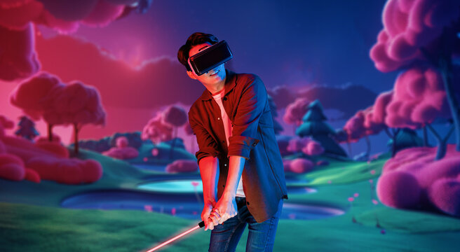 Skilled gamer wearing VR glasses while playing golf at metaverse or golf court with purple sky. Attractive golf player or athlete practicing sport skill while entering in simulated world. Ingenuity.
