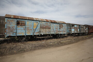 Abandoned old railway wagons at station, old train wagons in an abandoned station
