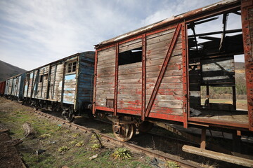 Abandoned old railway wagons at station, old train wagons in an abandoned station