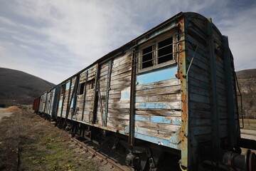 Abandoned old railway wagons at station, old train wagons in an abandoned station