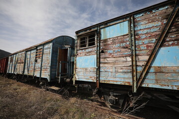 Abandoned old railway wagons at station, old train wagons in an abandoned station