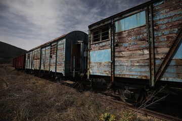 Abandoned old railway wagons at station, old train wagons in an abandoned station