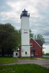 The old lighthouse at Presque Isle State Park on Lake Erie in Pennsylvania under cloudy skies in late spring