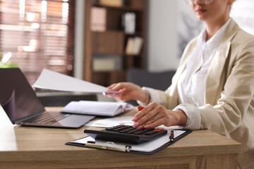 Professional banker working at desk in office, closeup